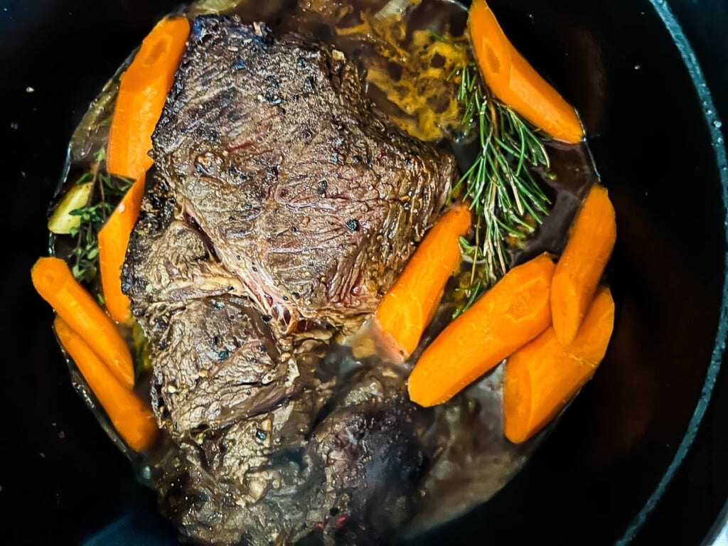 Cooked pot roast in Dutch oven.