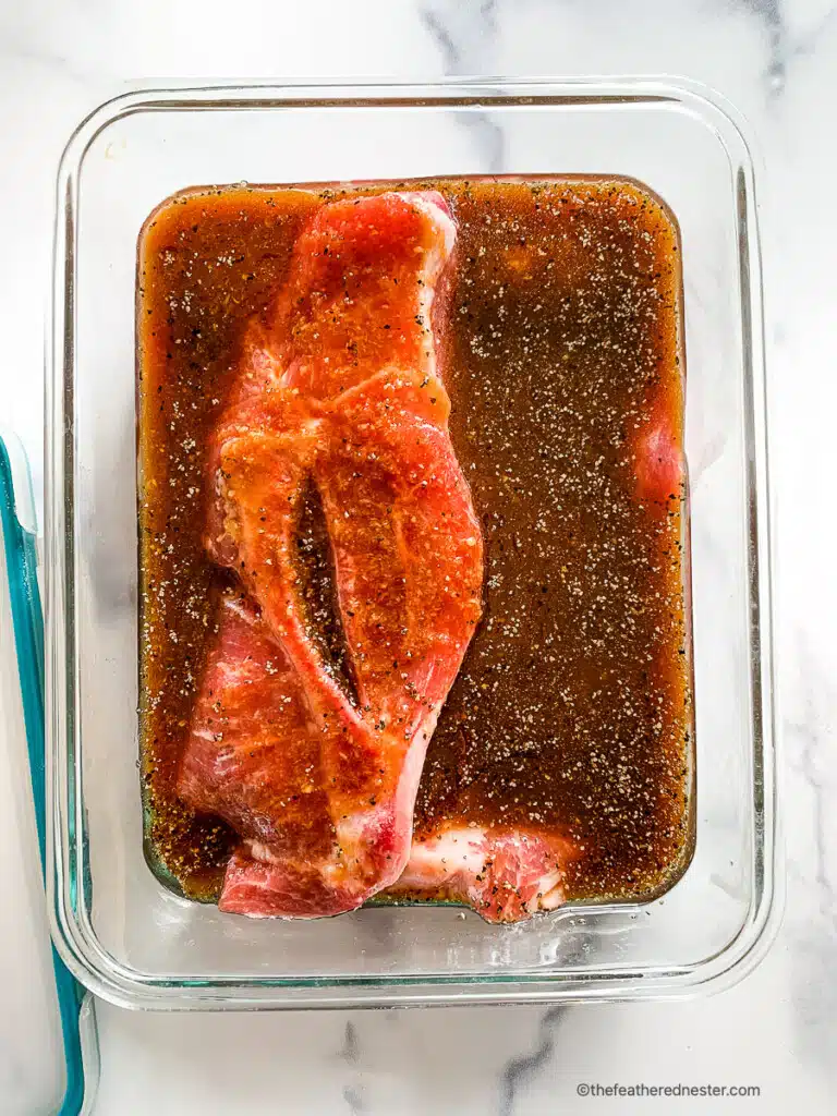 Raw meat sitting in a marinade.