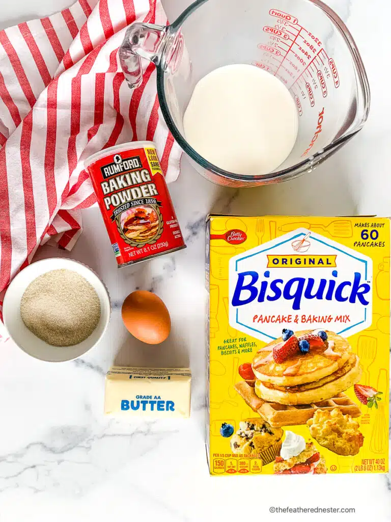 Packages and bowls with ingredients for Bisquick breakfast recipe.