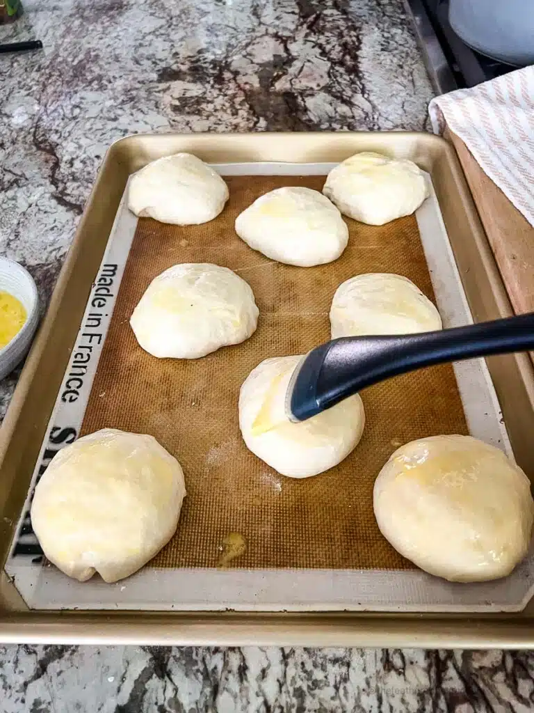 basting egg wash on each dough.