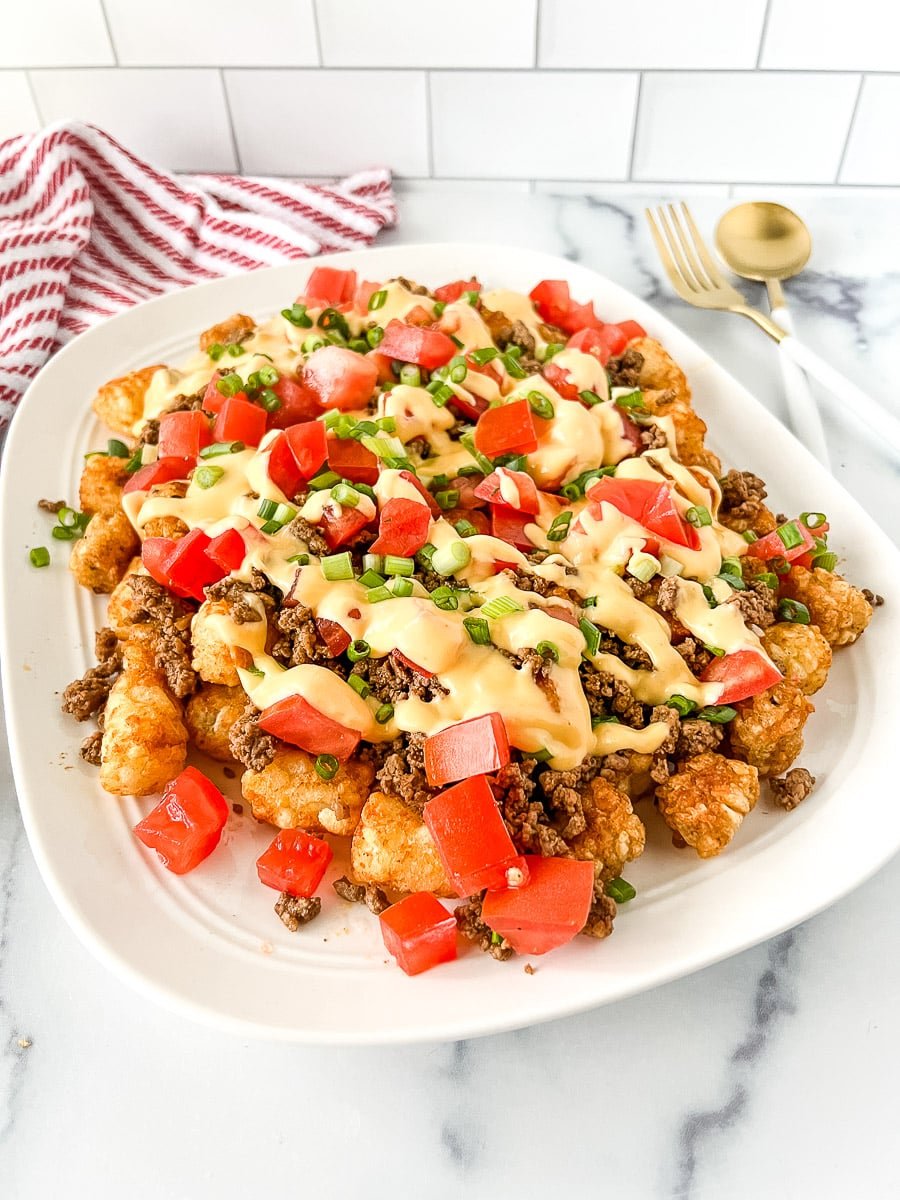 White serving platter piled high with tachos.