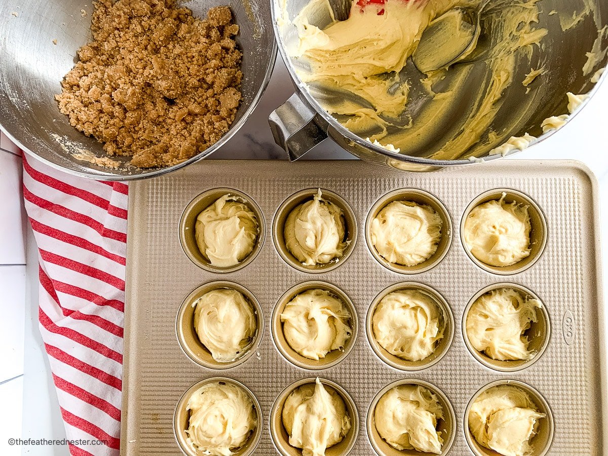 Batter for cinnamon streusel muffins in a baking pan.