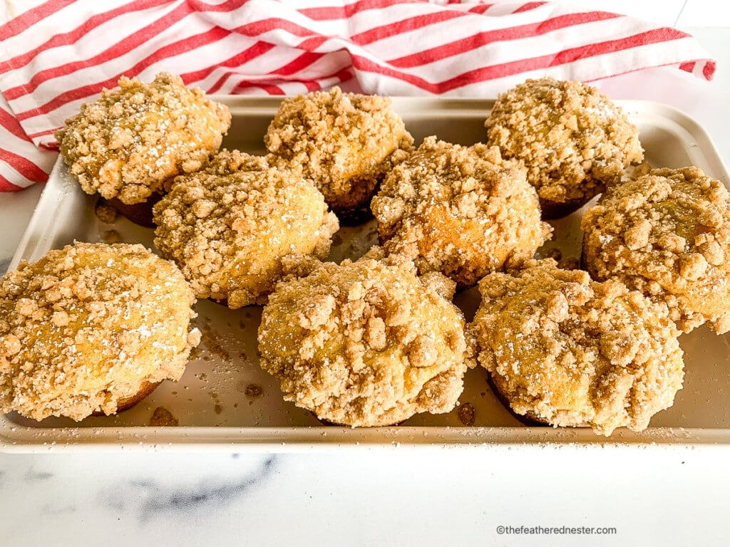 Fresh cinnamon streusel muffins on a serving tray.