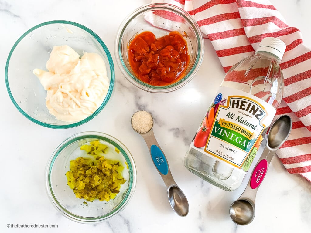 Bowls of mayo, ketchup, relish, and vinegar for In and Out sauce recipe.