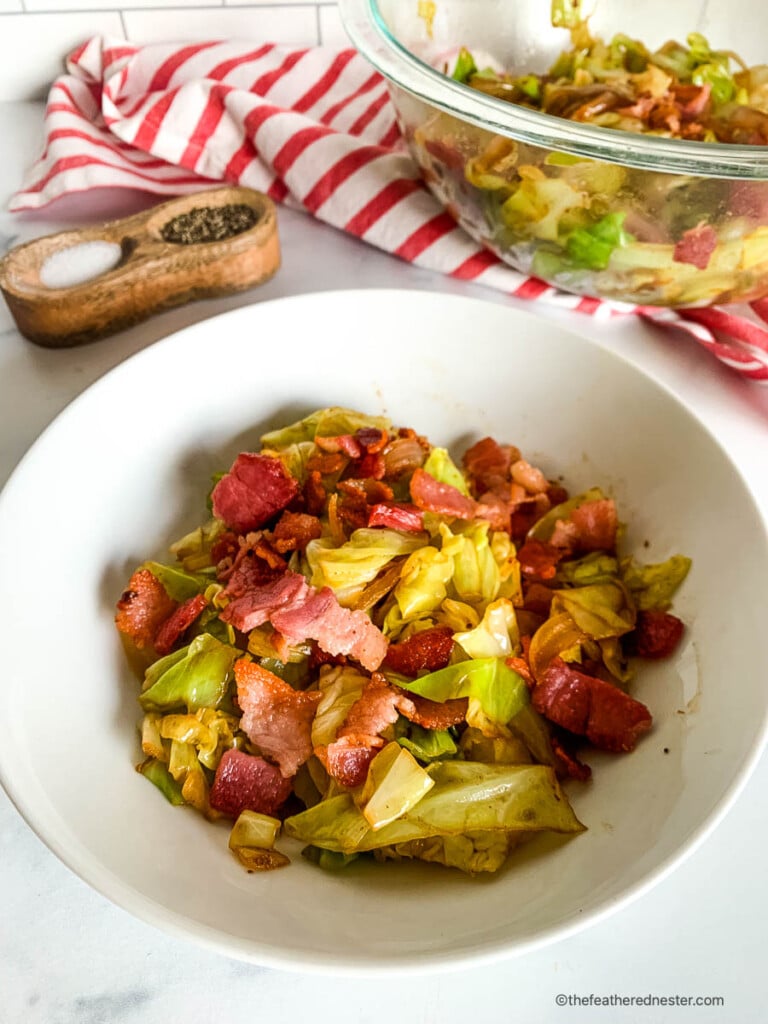 Crispy cabbage and bacon in a white bowl.