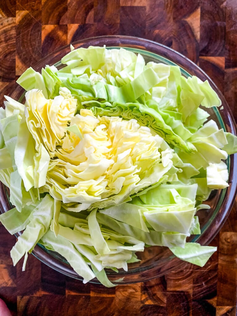 Sliced cabbage in a prep bowl.