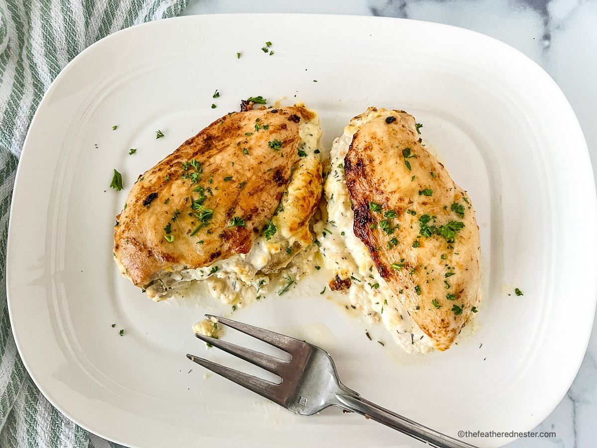 Ruth Chris stuffed chicken on a white plate.