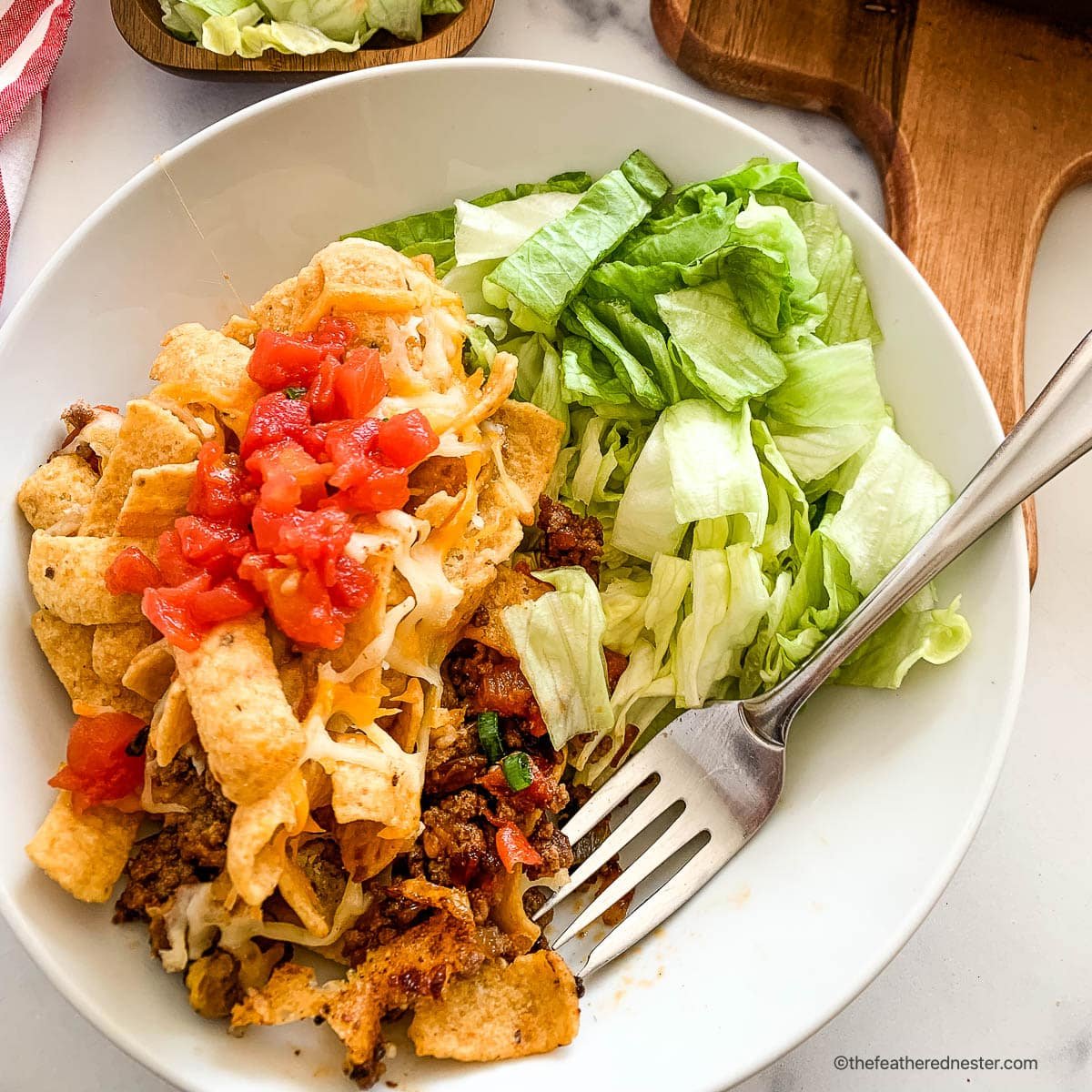 Plate of taco casserole with Fritos.