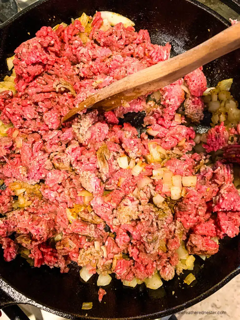 cooking taco meat in a pan.