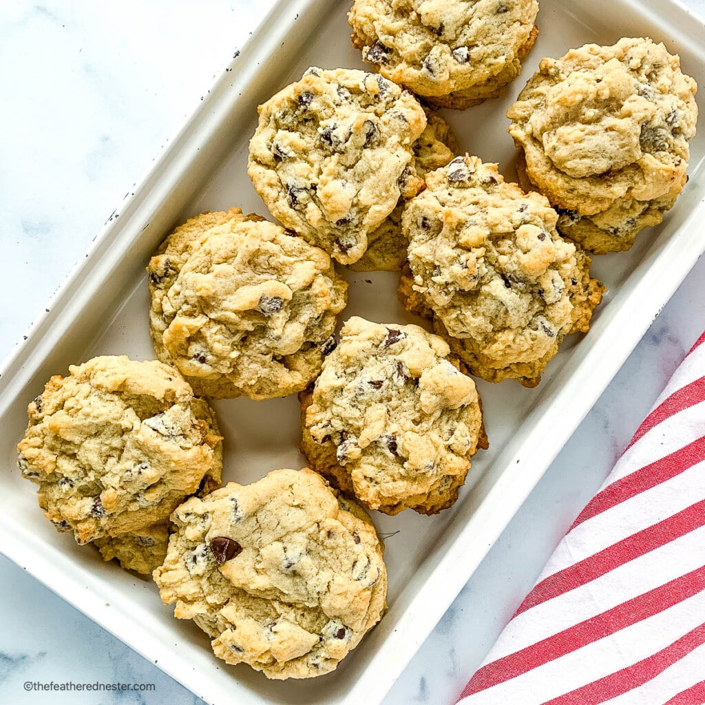 Two dozen eggless chocolate chip cookies on a serving platter.