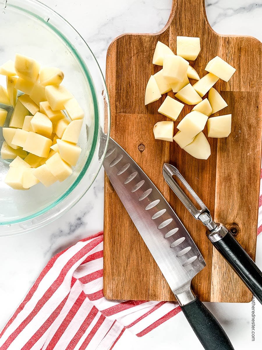 Dicing russet potatoes for old fashioned yeast roll recipe.