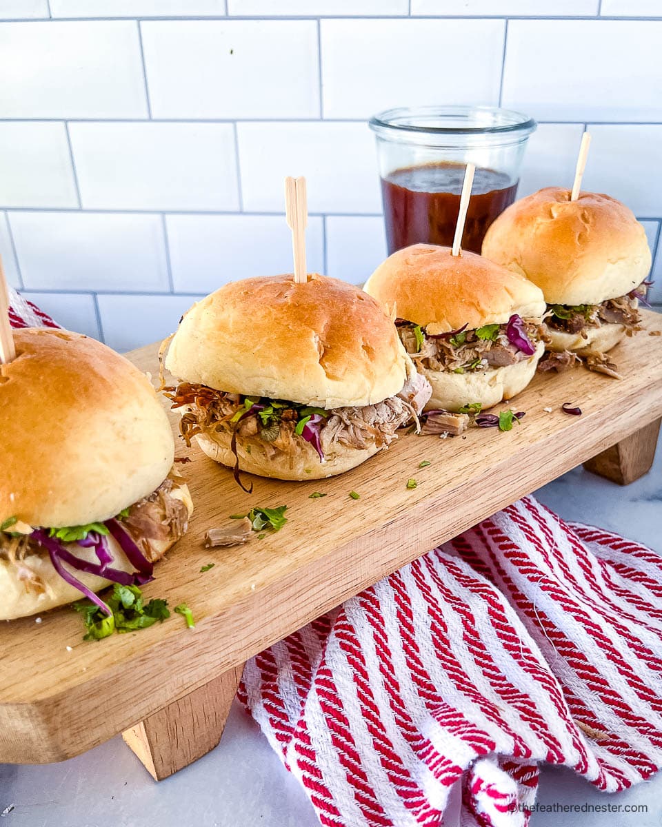 Game day sandwiches filled with Dutch oven pulled pork, served on buns.