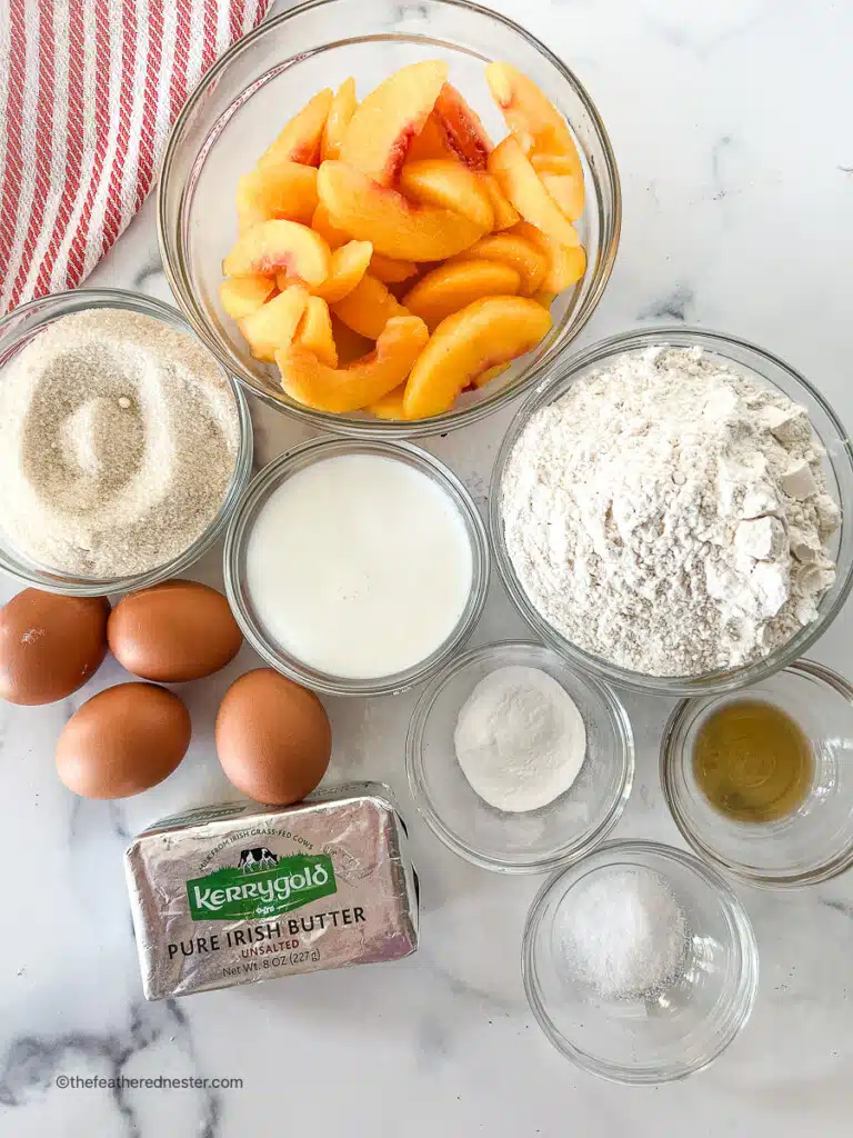 Small bowls of ingredients for a pound cake recipe with peaches.