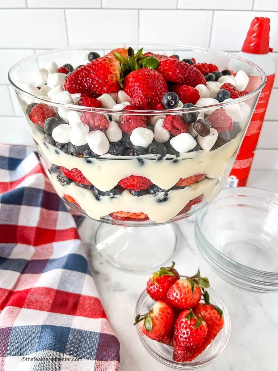 Beautiful layered cheesecake salad in a trifle bowl.