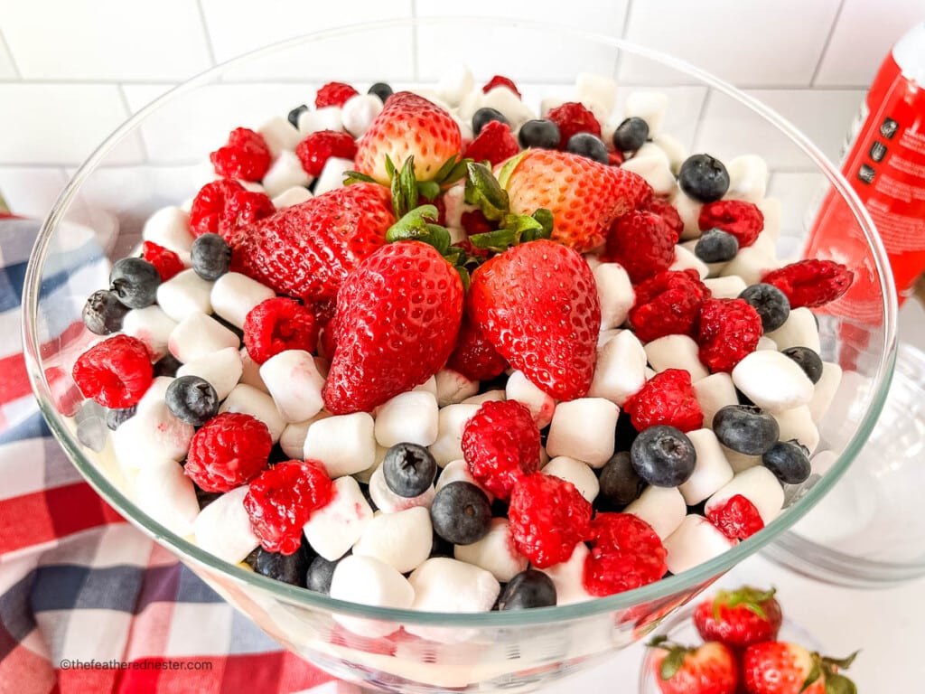 Patriotic red white and blue 4th of July salad in a large glass serving bowl.