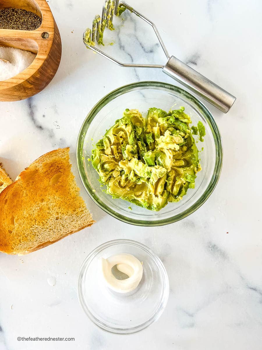 creamy guacamole in a small glass bowl.