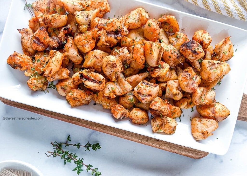 Serving platter filled with Chicken Fil A grilled nuggets.