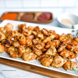 Platter full of grilled chicken bites.