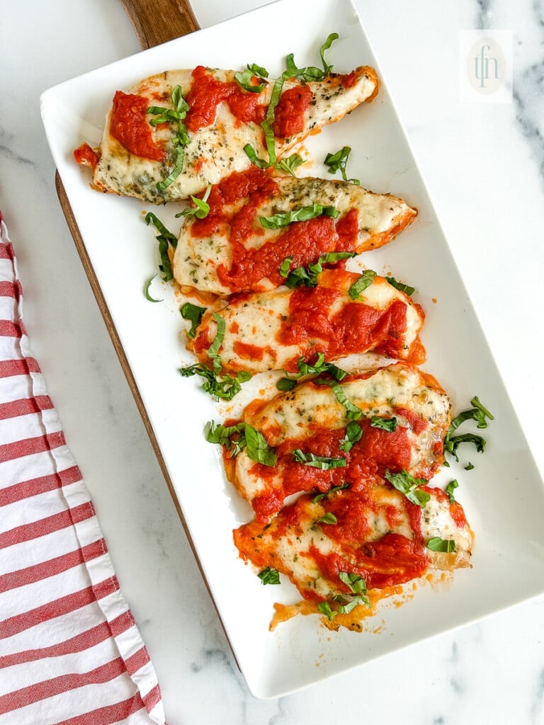 Italian chicken cutlets on a platter, ready for serving.