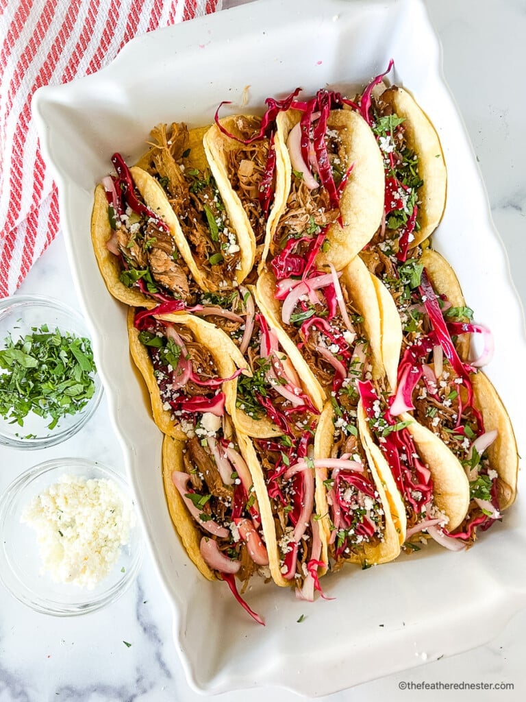 Pickled taco slaw served on top of pork street tacos.