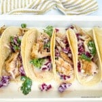 Grilled fish tacos on a platter.