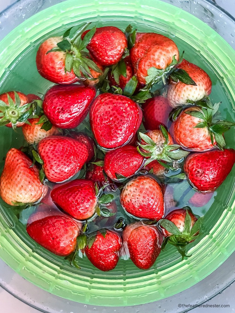 Rinsing fresh berries in water.