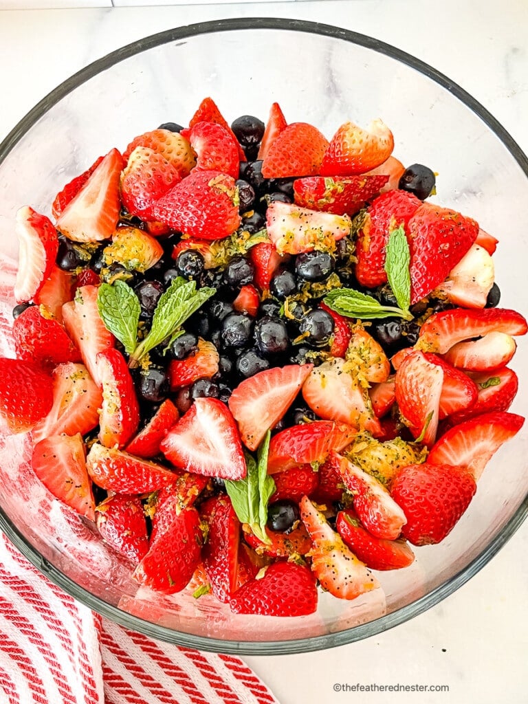 Mixed berry salad in a large glass bowl.
