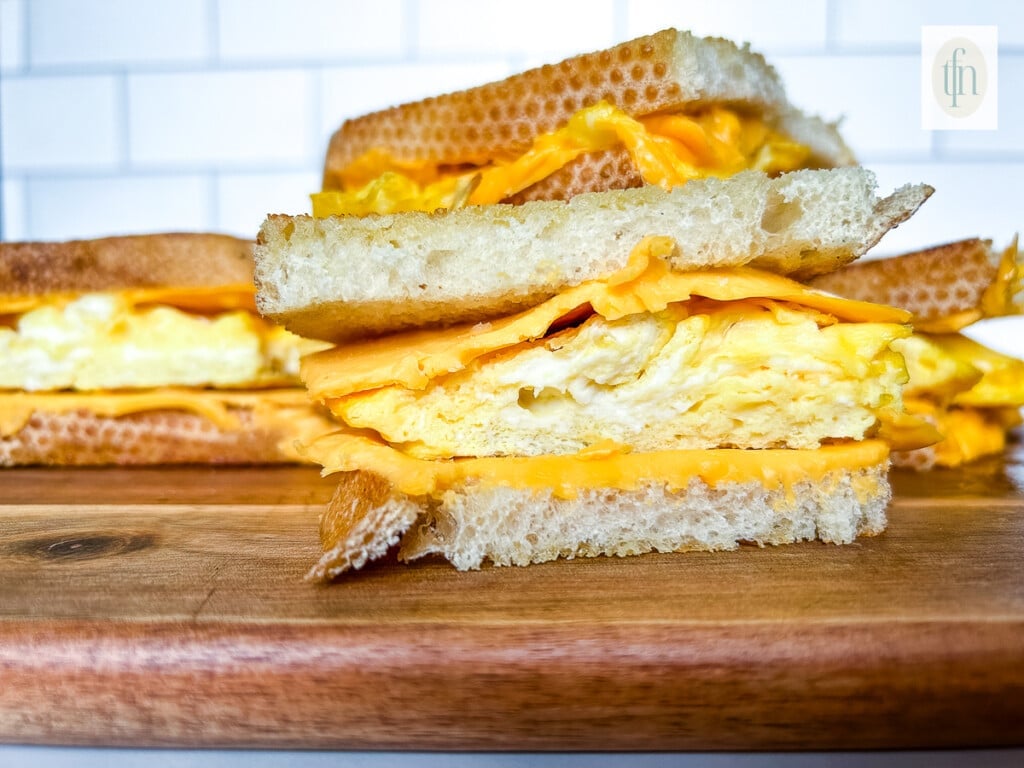 Close up of scrambled egg sandwich cut into triangles