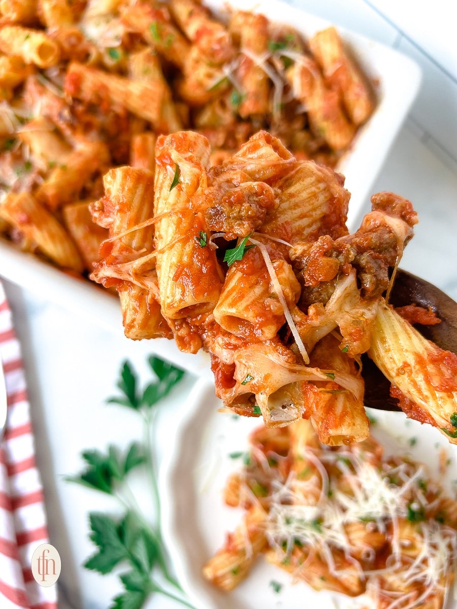 Sausage rigatoni on a fork.