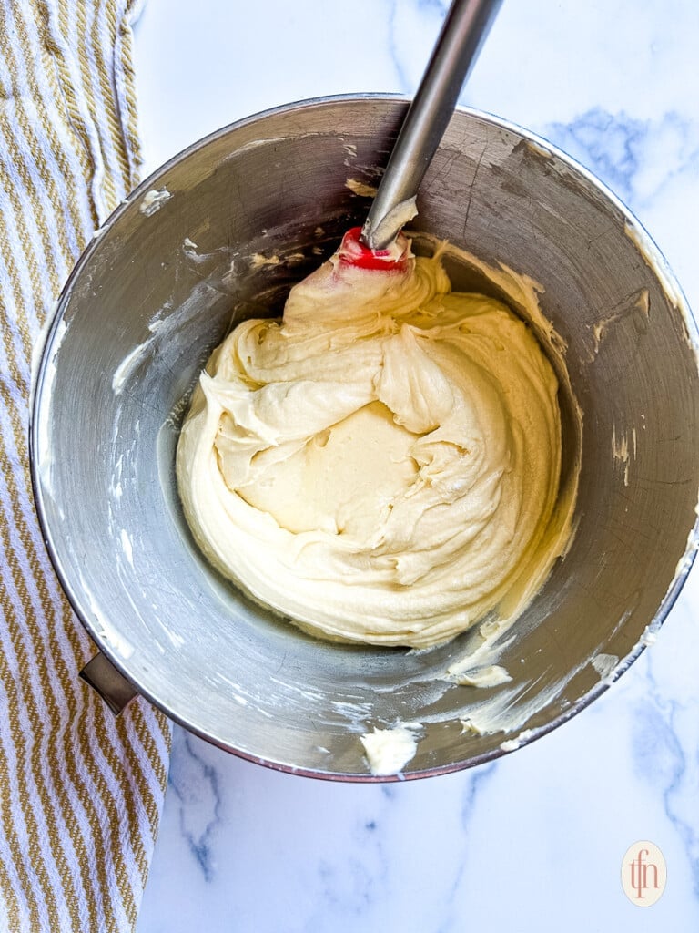 Light and fluffy butter and egg mixture in a stand mixer bowl