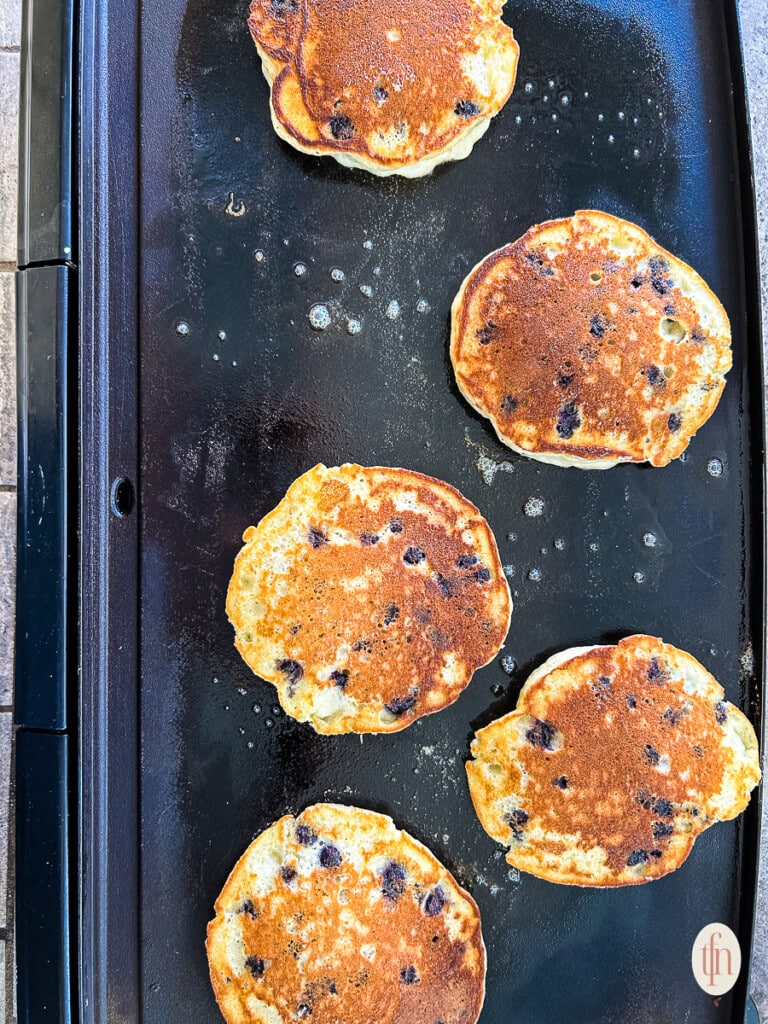 Making an easy pancake recipe on a griddle.