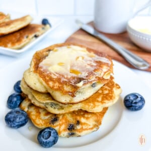 plated stack of 3-ingredient pancakes with blueberries.