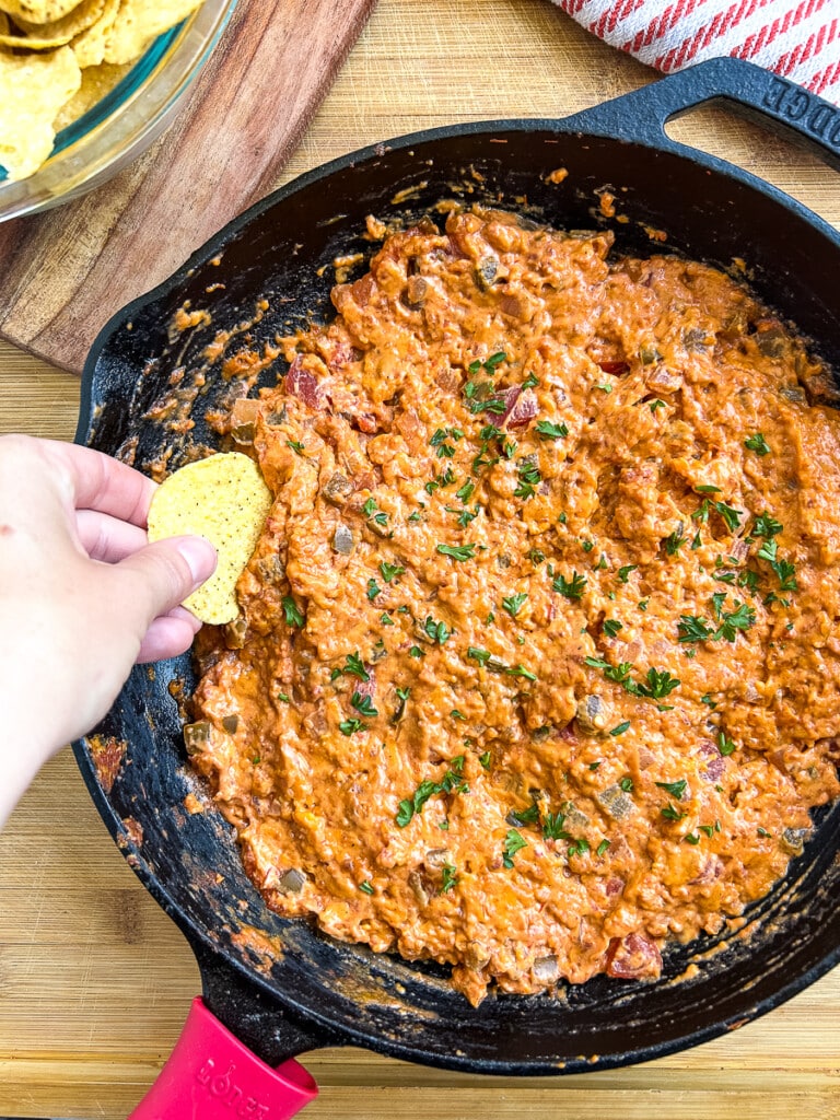 Large cast iron skillet full of smoked chorizo queso.
