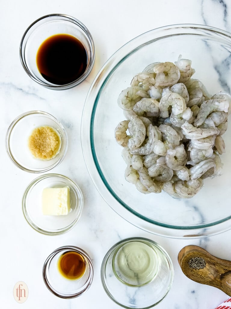 Ingredients for hibachi shrimp in glass bowls.