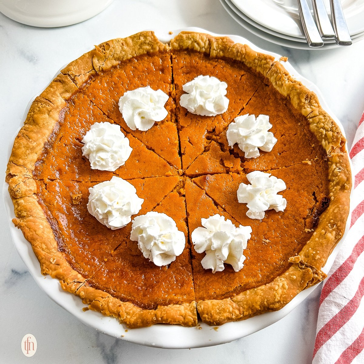 Whole carrot pie in a pie plate.