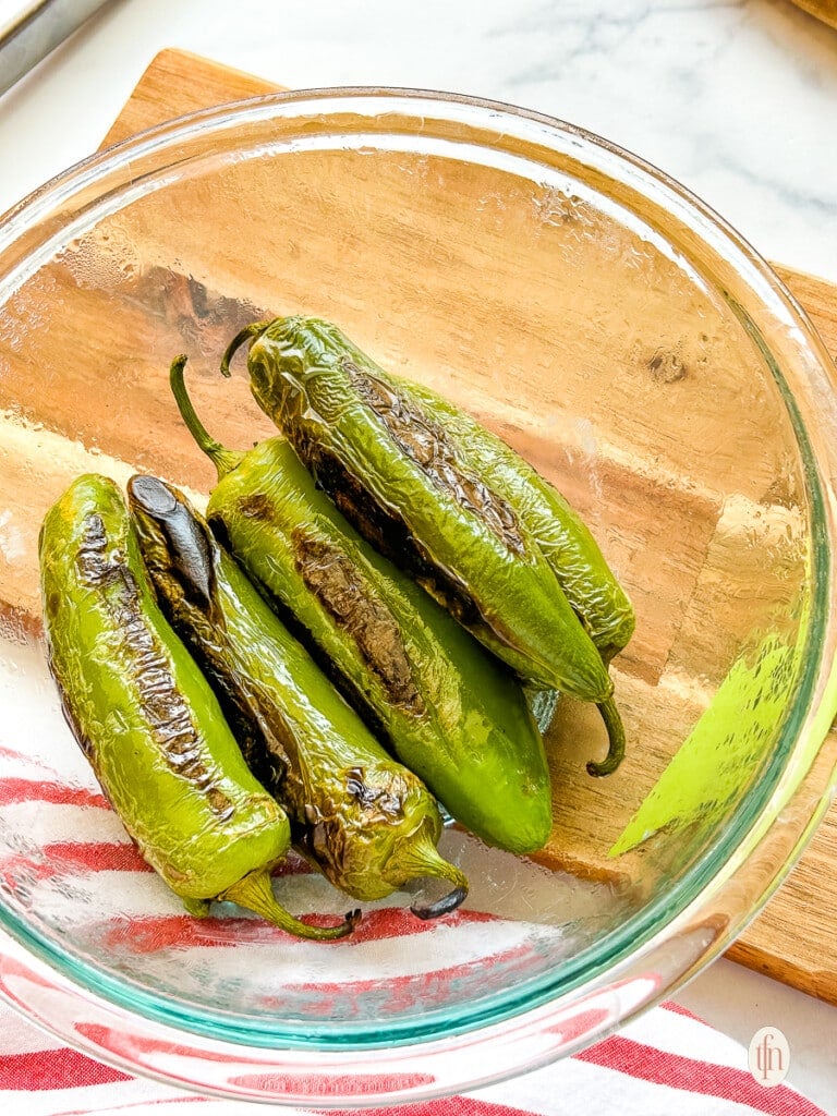 Looking down into a dish of pan roasted jalapenos.