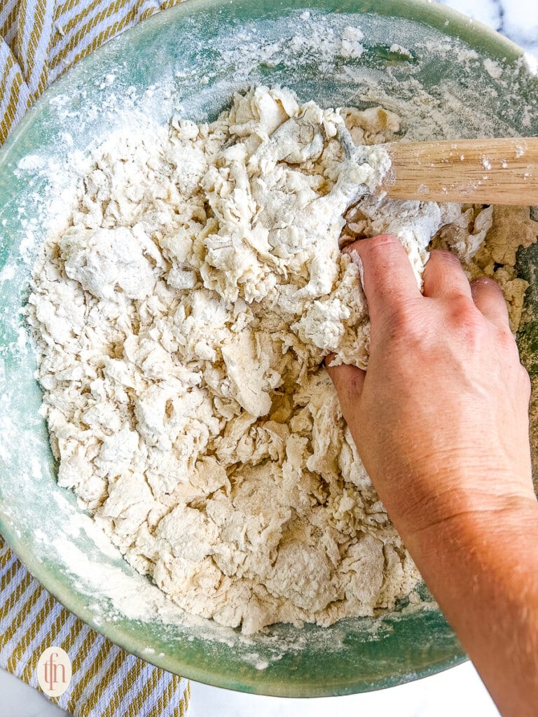 Mixing dough by hand.