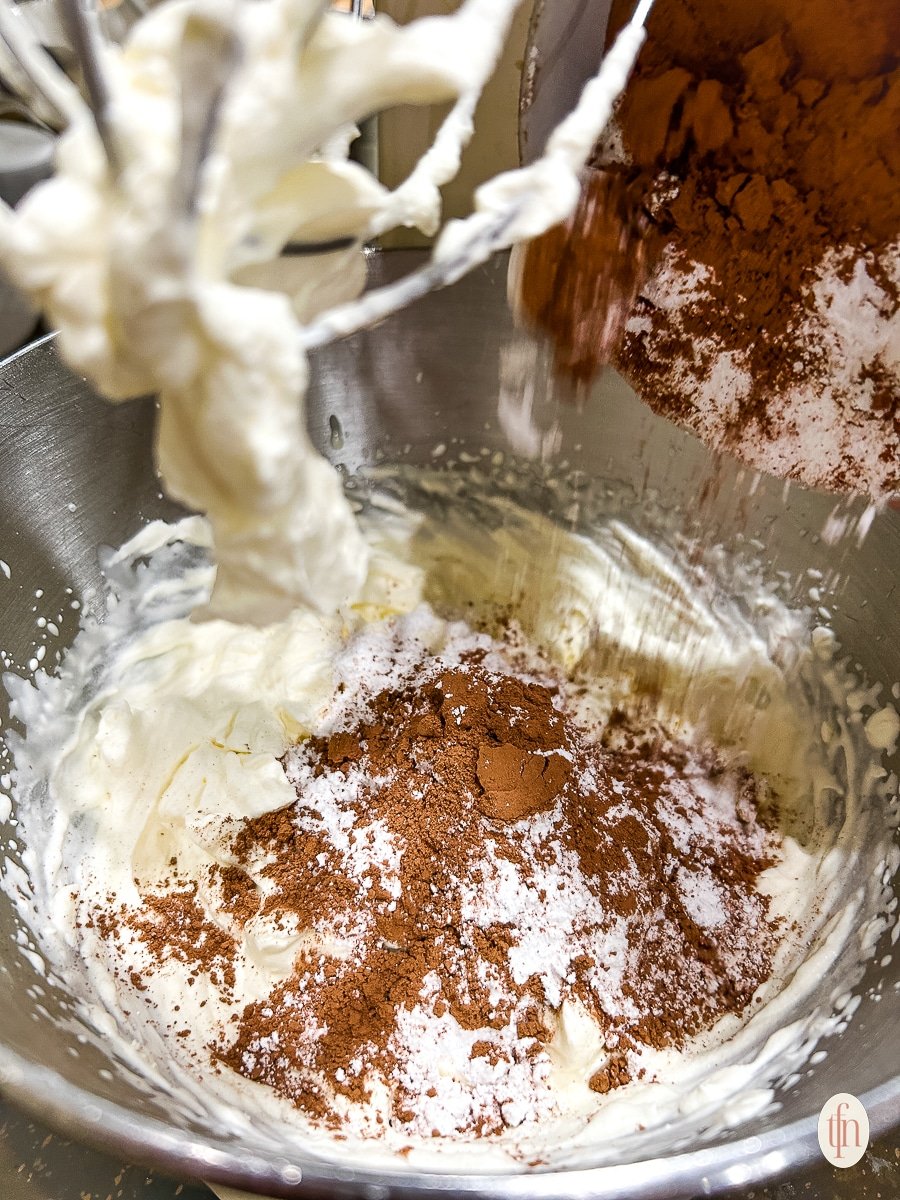 Whipping ingredients in a big bowl.