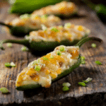 Jalapeno peppers stuffed with cream cheese and cheddar cheese.