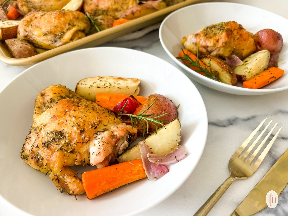 Golden brown oven-baked chicken thighs and veggies placed in serving bowls.