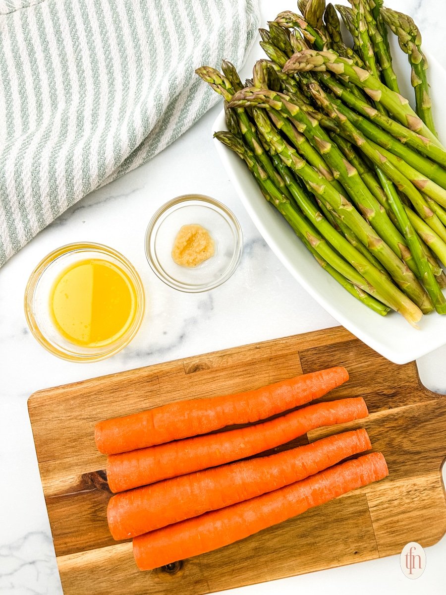 Prepared ingredients for roasted carrots and asparagus.