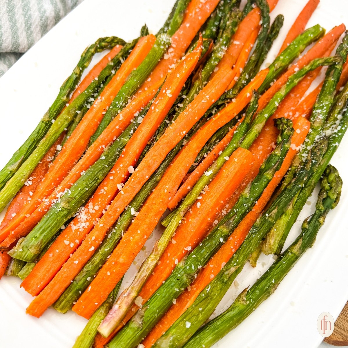 A plate of roasted carrots and asparagus.