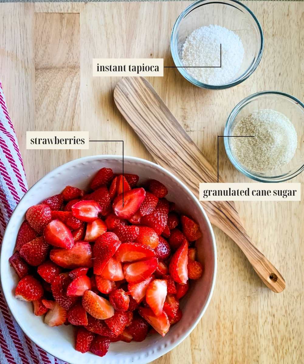 Labeled ingredients for strawberry filling of Bisquick cobbler.