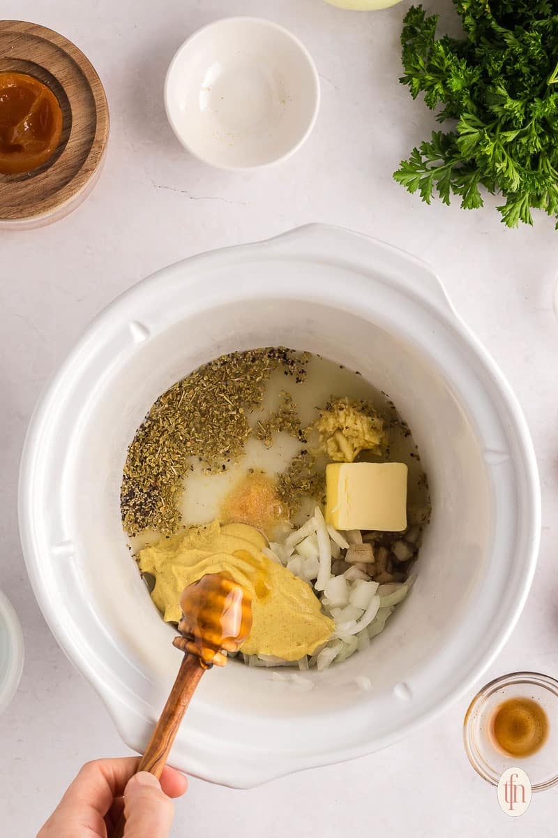 mixing ingredients in the slow cooker.