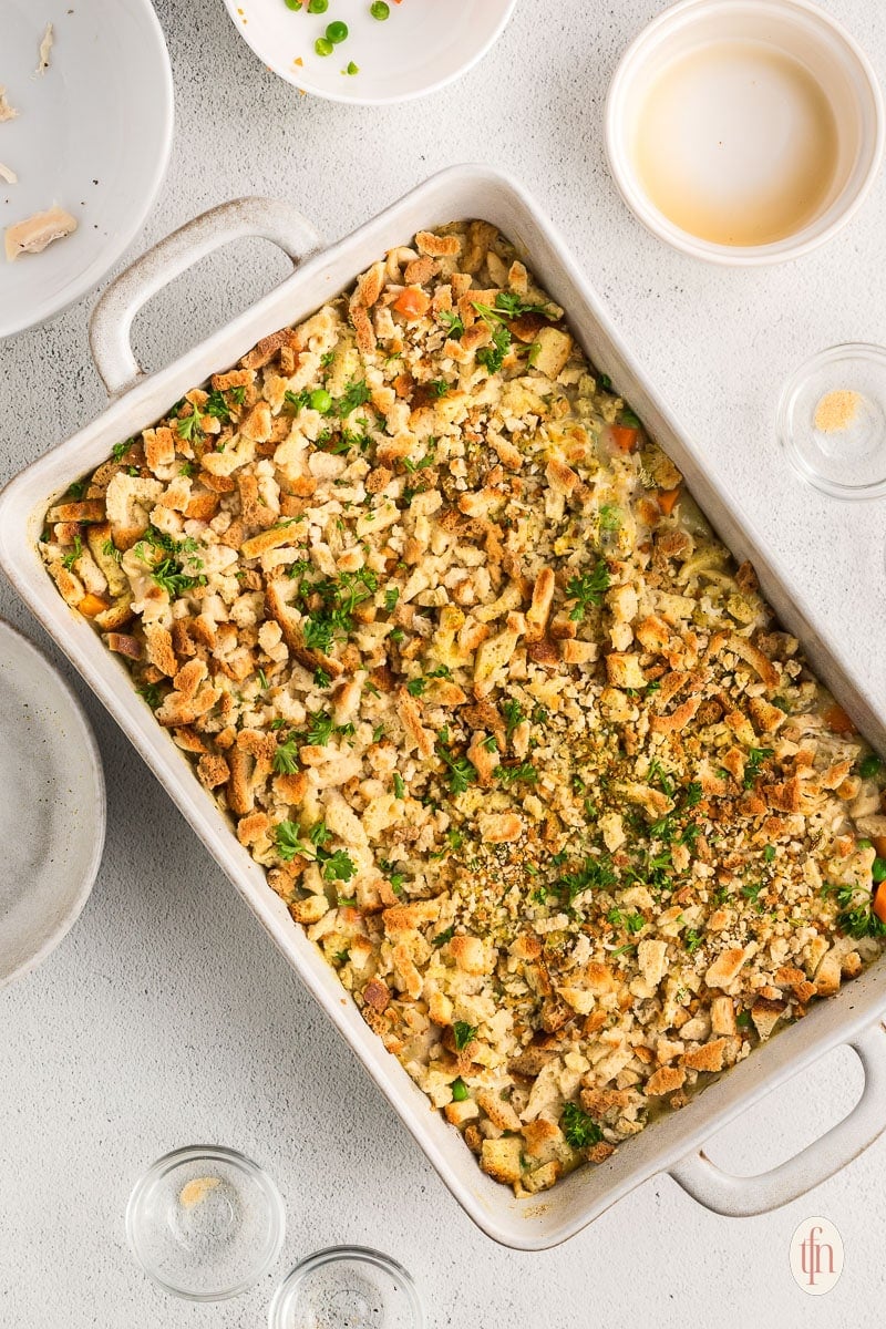 chicken stove top stuffing casserole in a white baking dish.