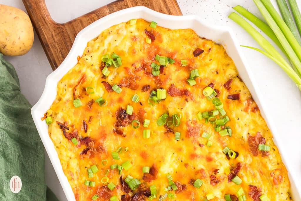 A casserole dish of baked mashed potatoes recipe.