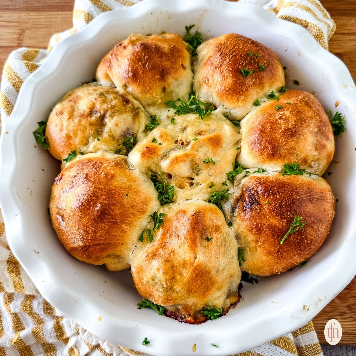 a casserole dish of stuffed meat buns.