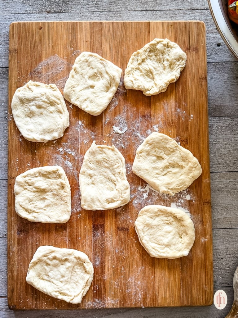 8 dough pieces rolled flat.