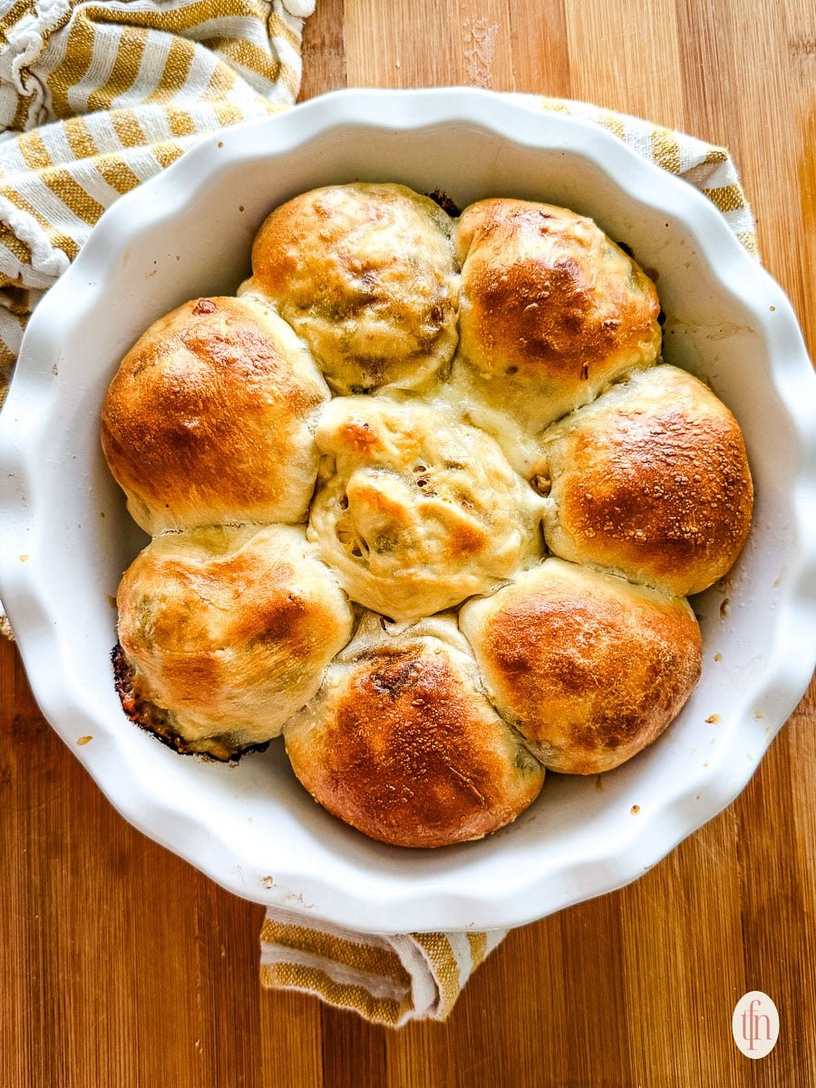 a casserole dish of baked stuffed buns.