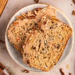 Two slices of loaf on a round plate.